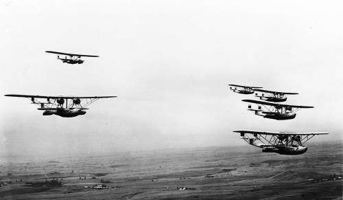 A formation of P2Y-1 aircraft; photo taken near Sand Point, Seattle or near Sitka, both bases from which these Navy seaplane squadrons flew.
