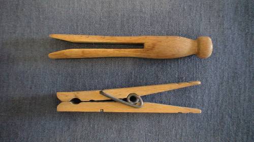 A clothespin of the early 20th century alongside one that later replaced it.