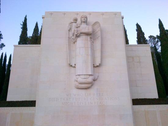 Shrine at Rhone American cemetery in Draguignan France with Blessed Mother and Child and inscription below.