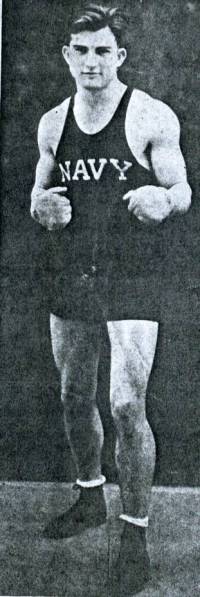 In boxing pose, star footballer and captain of the Naval Academy boxing team, George Lambert poses just before 1935 graduation.