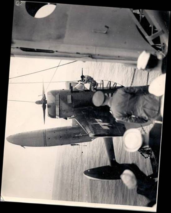 A rotated photo of the recovery by USS Pasadena of one of its float planes that did not 'return to the ship' normally.